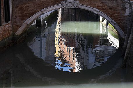 Venetian reflections under the bridge, 