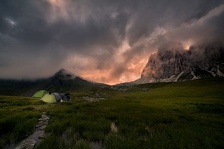 Moonlight campground in front of Croda da Lago mountain, Cadore, dolomites, Italy