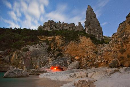 Cala Goloritz photographed during a full moon night. The stars frame the note pinnacle (143 mt)