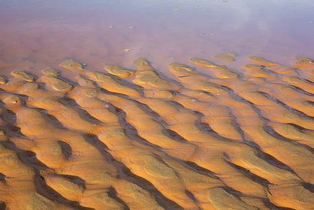 Detail of Piscinas dunes, the colors of a warm sunset, the dunes, the desert of Sardinia, a place full of magic, unique in the Mediterranean, Arbus, Sardinia, Italy