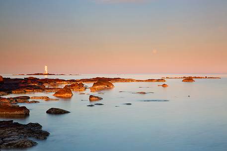 The Mangiabarche lighthouse overlooking the bay of the same name and is a point of interest for landscape photographers of the most famous in Sardinia, dawn or dusk or during a storm this pretty little bay is full of great energy, Sant'Antioco, Sulcis-Iglesiente, Sardinia, Italy