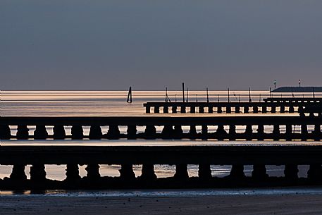 Sunset from breakwater, Lido di Jesolo, Venice, Italy.