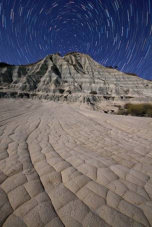 The badlands of Palizzi Marina illuminated by the light from the moon and the celestial vault crowned