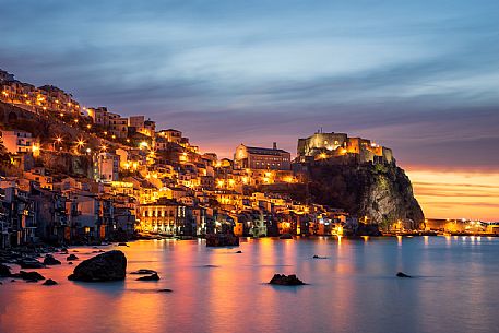 The village of Chianalea di Scilla with a view of the Ruffo Castle at sunset, Costa Viola, Calabria, Italy, Europe