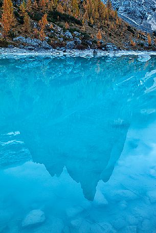 Punta Sorapiss is reflected on the Sorapiss lake, Cortina d'Ampezzo, dolomites, Italy