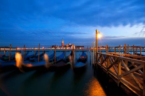 Evening's lights on the gondolas in St. Mark's basin in Venice, in the background the Church of San Giorgio Maggiore, Venice, Italy, Europe