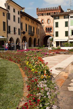 Flower festival in San Vito al Tagliamento, in the background the Raimonda tower gate, Friuli Venezia Giulia, Italy, Europe