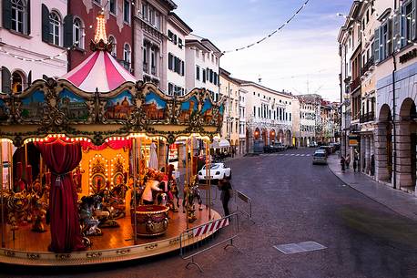 Carousel and Christmas lights in the town center in Udine, Friuli Venezia Giulia, Italy, Europe