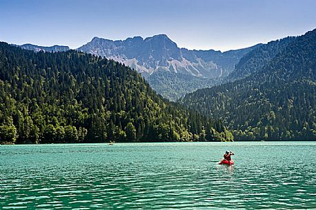 Canoe tourists on Lake Sauris, Carnic Alps, Friuli Venezia Giulia, Italy, Europe