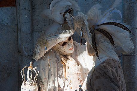 A pair of carnival masks under the loggia of the Doge's palace in Venice.Italy