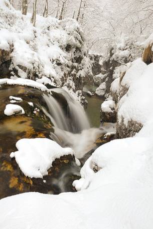 the Arzino river after snowfall