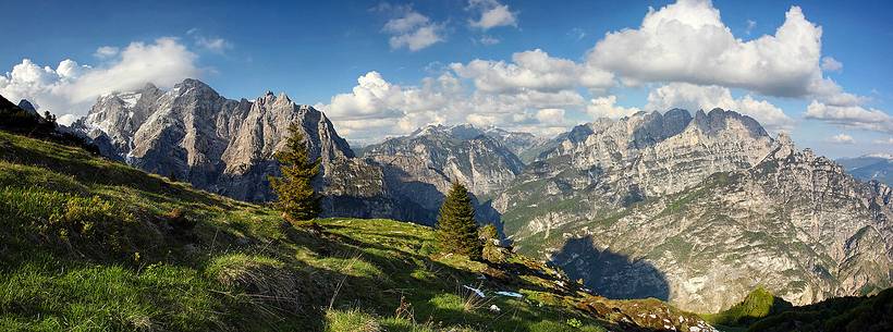 Spring meadows above Lodina Refuge with Laste-Preti and Vacalizza Mountain Group in the background