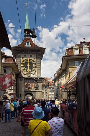 Tourists admiring the Clock tower or Zytglogge clock in the Kramgasse street, downtown of Bern, Unesco World Heritage, Switzerland, Europe