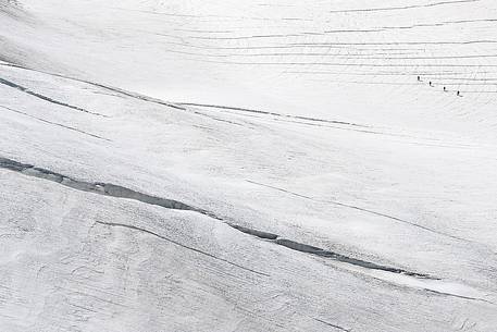 Alpinists on Aletsch glacier, view from Jungfraujoch, the highest railway station in the Alps, Berner Oberland, Switzerland, Europe