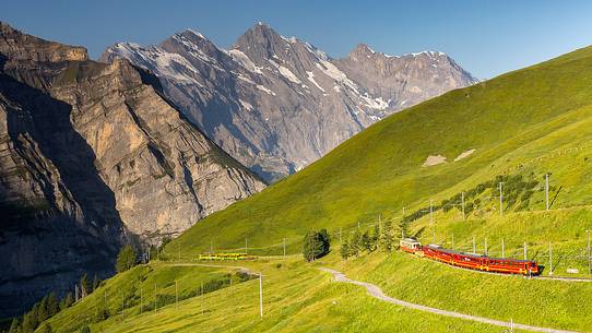 Typical swiss red train on Kleine Scheidegg from Wengen, Jungfraujoch Railway, Grindelwald, Switzerland, Europe