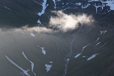 Detail of source of Rhone river near Furka pass at dawn, Valais, Switzerland, Europe