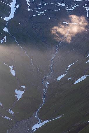 Detail of source of Rhone river near Furka pass at dawn, Valais, Switzerland, Europe