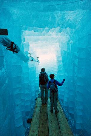 Mother and child inside the Rhone glacier, Furka pass, Valais, Switzerland, Europe