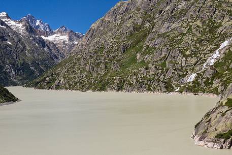 Grimselsee or Grisel lake and waterfall, Grimsel pass, Bernese alps, Switzerland, Europe