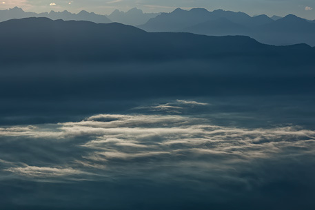 Sunrise on the Non Valley (Val di Non) in the clouds, Brenta dolomites, Italy