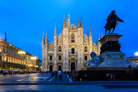 Plaza of the Cathedral in Milan at the blue hour with the monument to Vittorio Emanuele II in the foreground