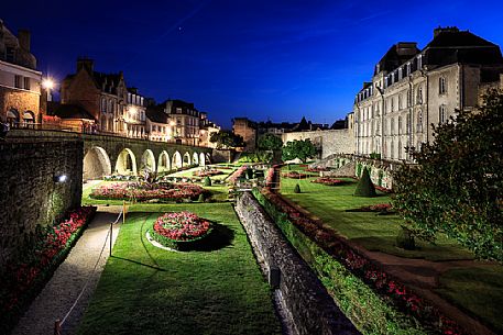 The famous gardens next to the medieval walls of the city of Vannes and in the background the Chateau de l'Hermine castle, Brittany, France, Europe