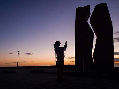 A woman taking a photo of 