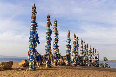 Shaman wooden pillars with colored cloth on Olkhon island, Bajkal lale, Russia