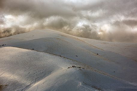 Winter landscape along the road to Forca di Presta mountain pass, Sibillini national park, Umbria and Marches, Italy, Europe