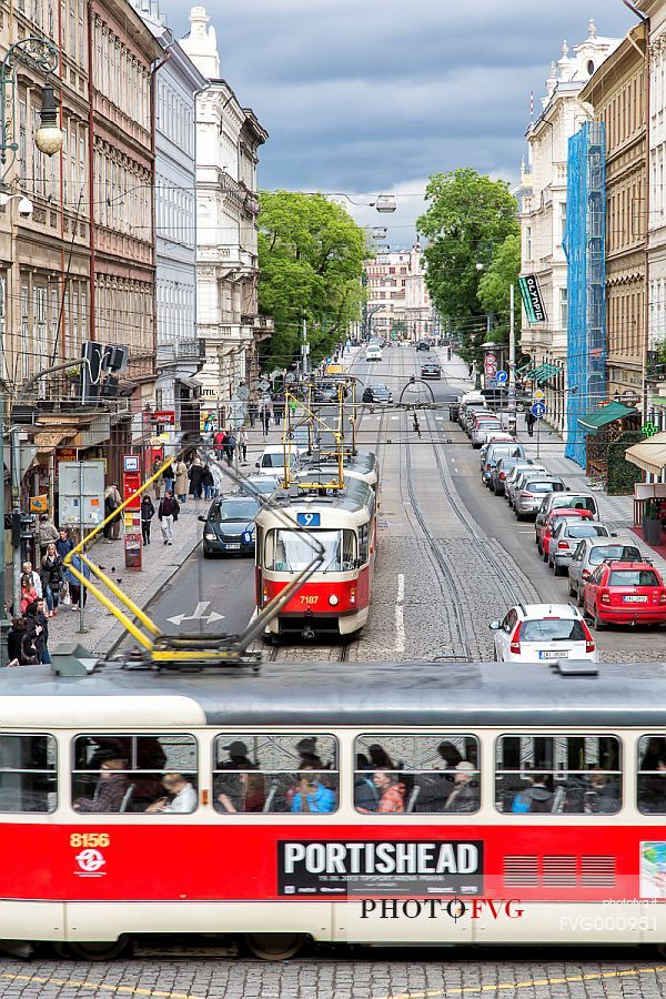 Red tram on a street of Prague new town