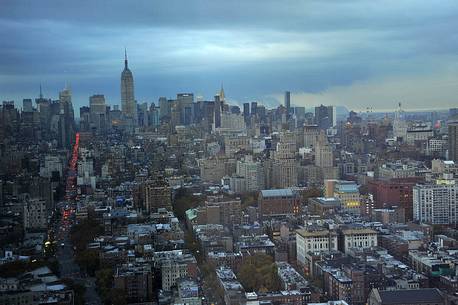 Overview of Manhattan buildings from the 46th floor of the Trump SoHo at the blue hour