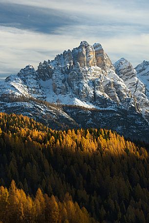 Autumn sunset on the Spiz di Mezzod Group in Val Zoldana. Characterized by the colorful larch forest, dolomites, Veneto, Italy, Europe