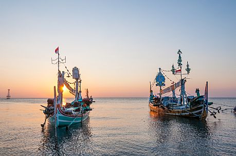 Traditional boats in a beautiful sunset in Lovina Beach, Bali island, Indonesia