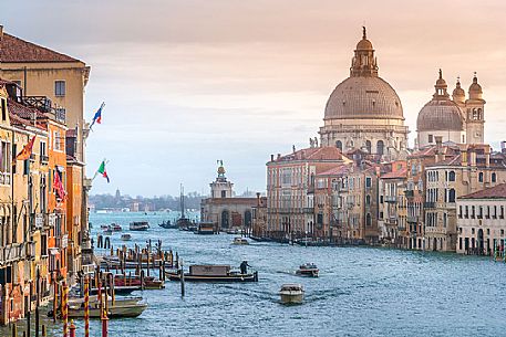 Motorboats in the Grand Canal and in the background the Santa Maria della Salute church from Accademia bridge, Venice, Italy, Europe